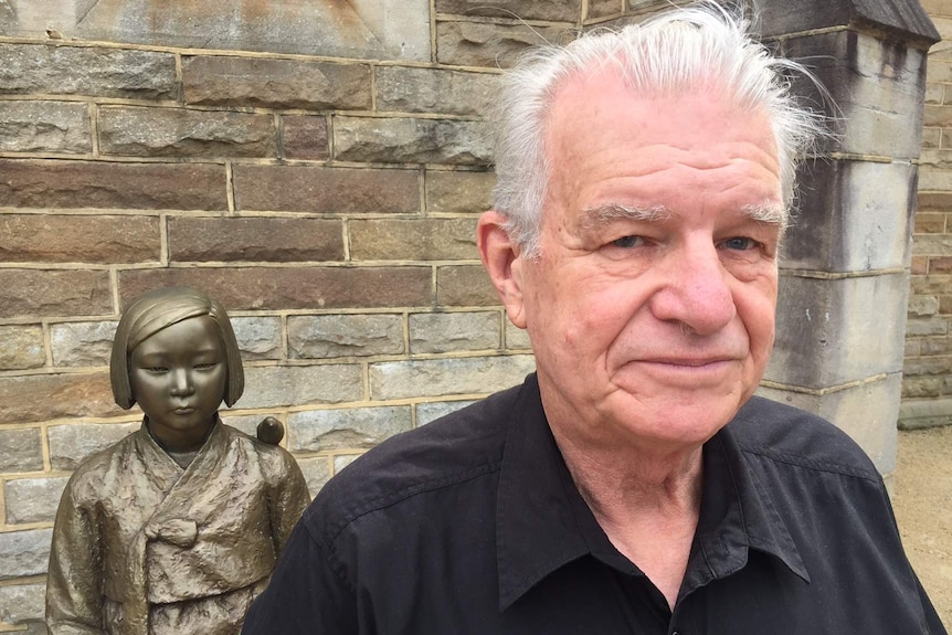 Rev. Bill Crews in front of the comfort women memorial at the Ashfield Uniting Church