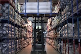 A forklift transports cloth in a factory in China