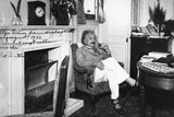 Portrait of physicist Albert Einstein sitting in an armchair and smoking a pipe, circa 1932.