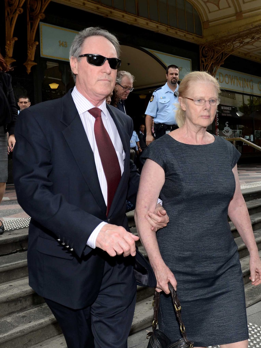 Former Hey Dad! actor Robert Hughes and his wife Robyn Gardiner leave Downing Centre court in Sydney, on March 26, 2014. Hughes has pleaded not guilty to 11 charges relating to the sexual and indecent assault of five girls.