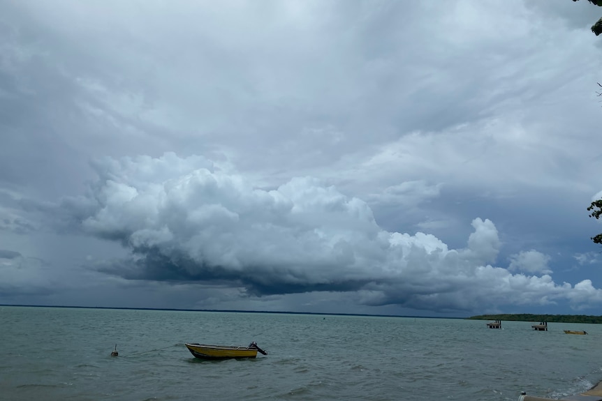 The ocean and storm clouds in the distance.