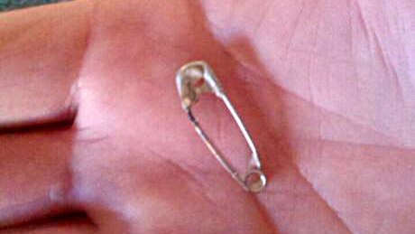 Safety pin found in cheese