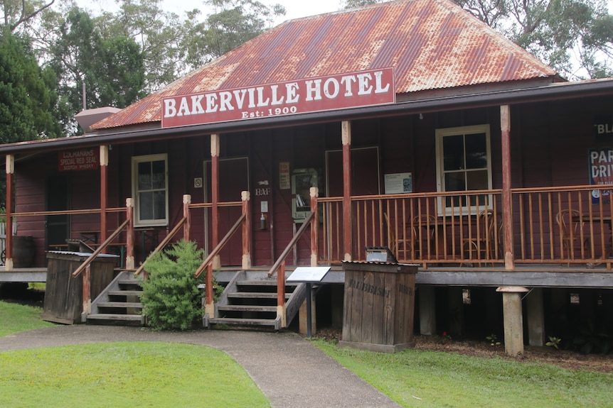 Old wooden and iron building with Bakerville Hotel sign 