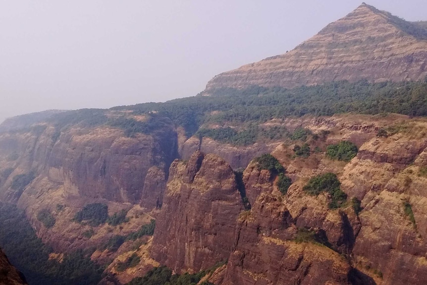 Layered rocks making up the side of a mountain