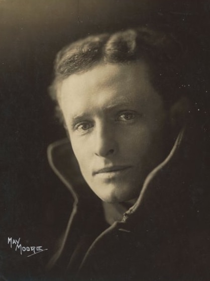 A black and white photo of a man in the 1920s.