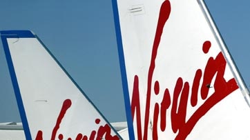Virgin says it is frustrated over negotiations with the Queensland Government to fly to more regional centres.