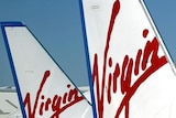 Virgin says it is frustrated over negotiations with the Queensland Government to fly to more regional centres.