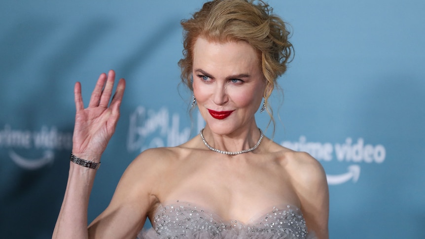 Nicole Kidman smiles and waves at the camera during the 'Being the Ricardos' premier, December 6, Los Angeles.