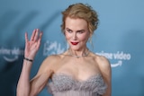 Nicole Kidman smiles and waves at the camera during the 'Being the Ricardos' premier, December 6, Los Angeles.