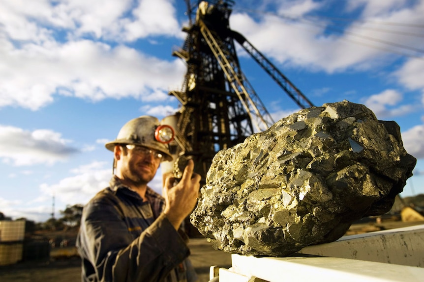 mine worker with nickel ore