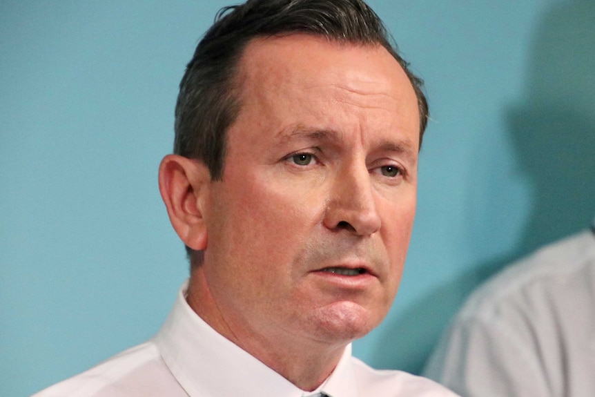 A tight head and shoulders shot of Premier Mark McGowan at a media conference.