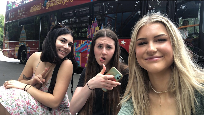 Nina Teague (left), Ella Johansson and Alexa Farland pose for a group photo on the streets of London