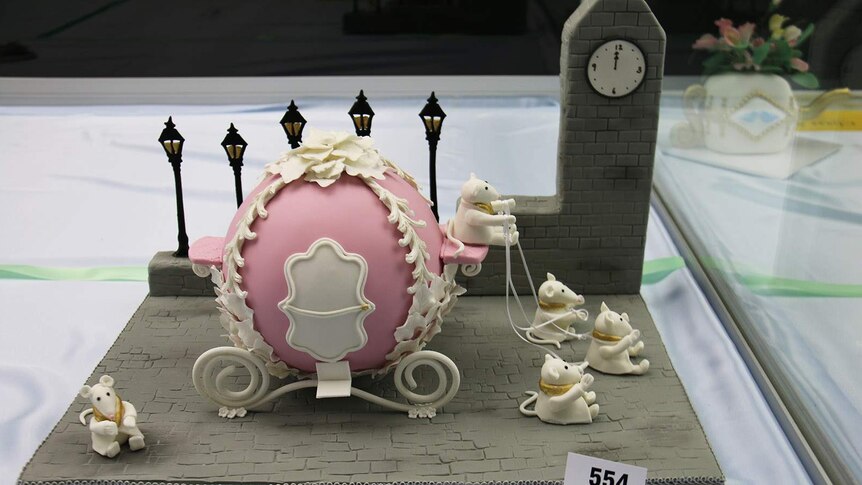 Cake of Cinderella's carriage and mice on a London street