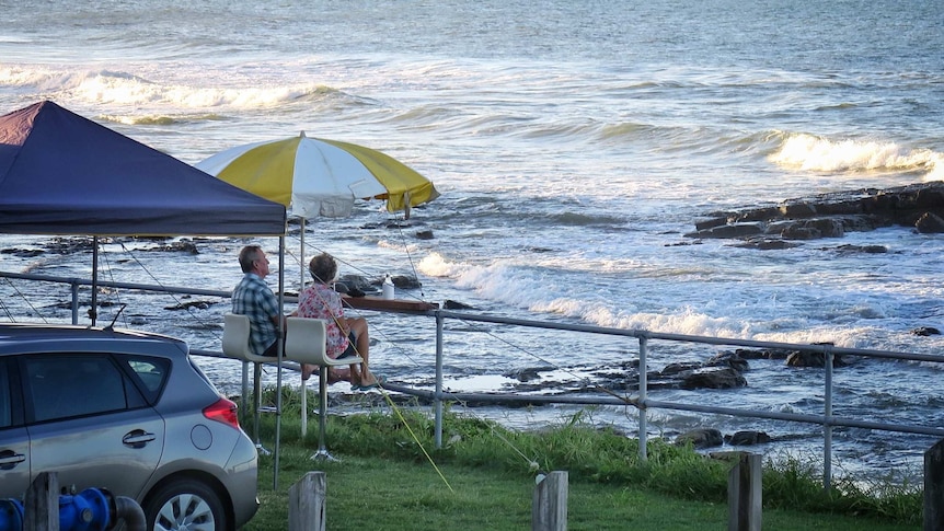 Couple sitting at the Mooloolaba Esplanade Caravan Park on the Sunshine Coast