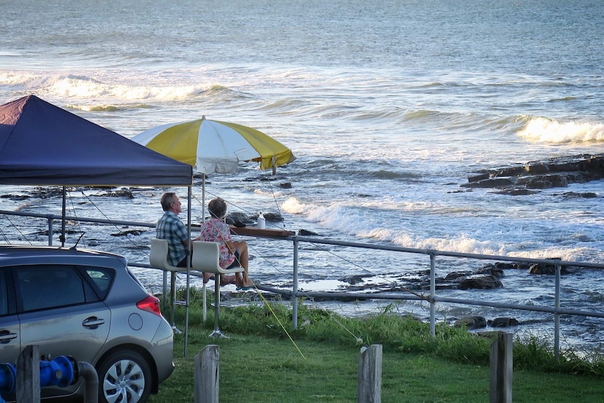 Couple sitting at the Mooloolaba Esplanade Caravan Park on the Sunshine Coast