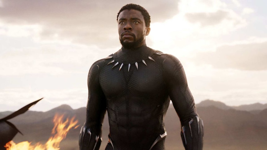 A character in Black Panther looks courageously ahead
