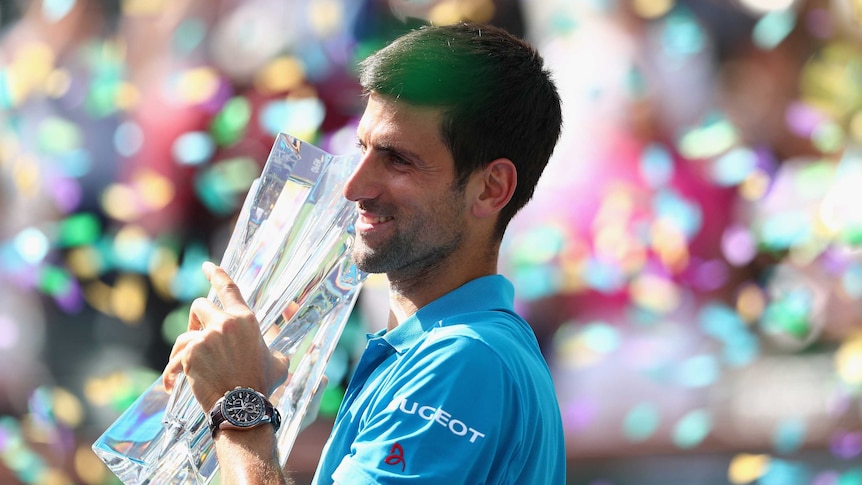 Novak Djokovic holds the Indian Wells trophy