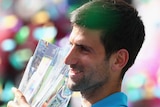 Novak Djokovic holds the Indian Wells trophy