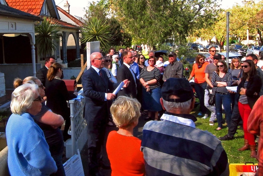 Homebuyers at an auction in Sydney