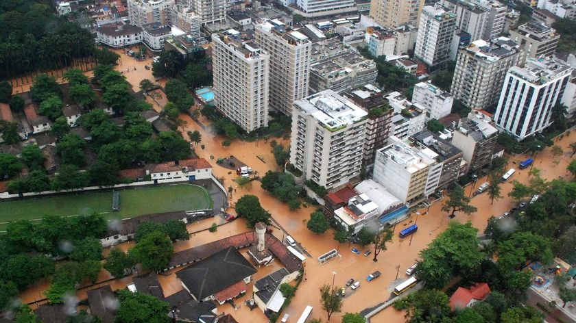 Floodwaters fill the streets in the Lagoa Rodrigo de Freitas neighbourhood of Rio de Janeiro