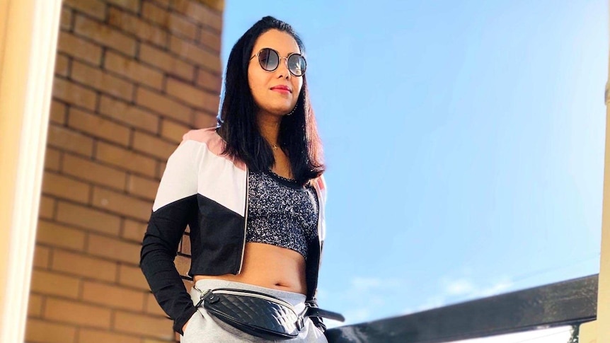 Amrita Sinha wearing athleisure on her balcony