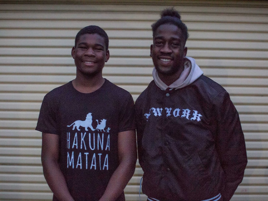 Kadiga and Youssif's older boys, Muhanad, 15 and Mohamed, 19 smile for a portrait