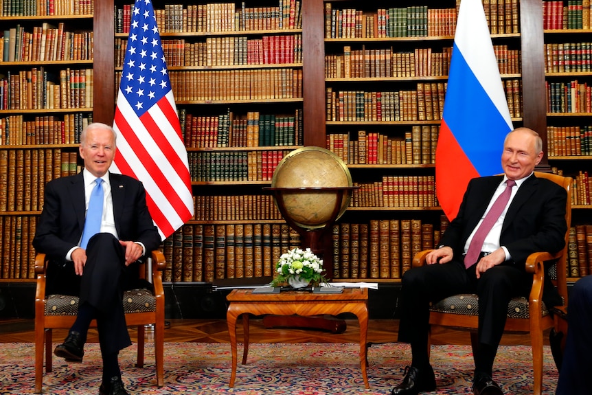 US President Joe Biden, left, and Russia's President Vladimir Putin, right, meet at the start of the US-Russia summit 