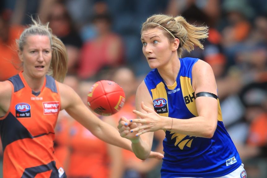 Grace Kelly of the Eagles passes the ball during an AFLW match against GWS
