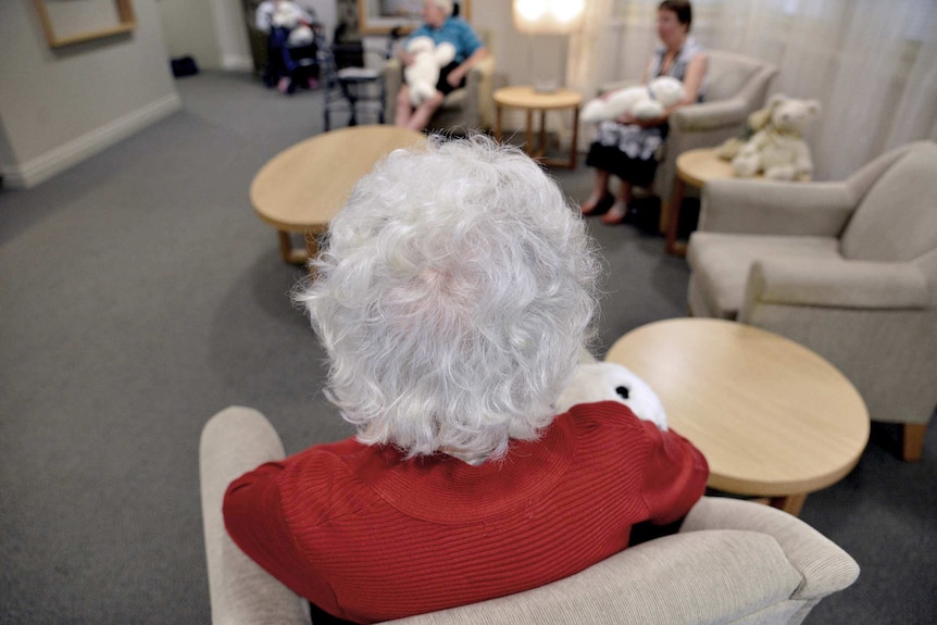 A nursing home resident in Brisbane sits in a common area, November 18, 2013.