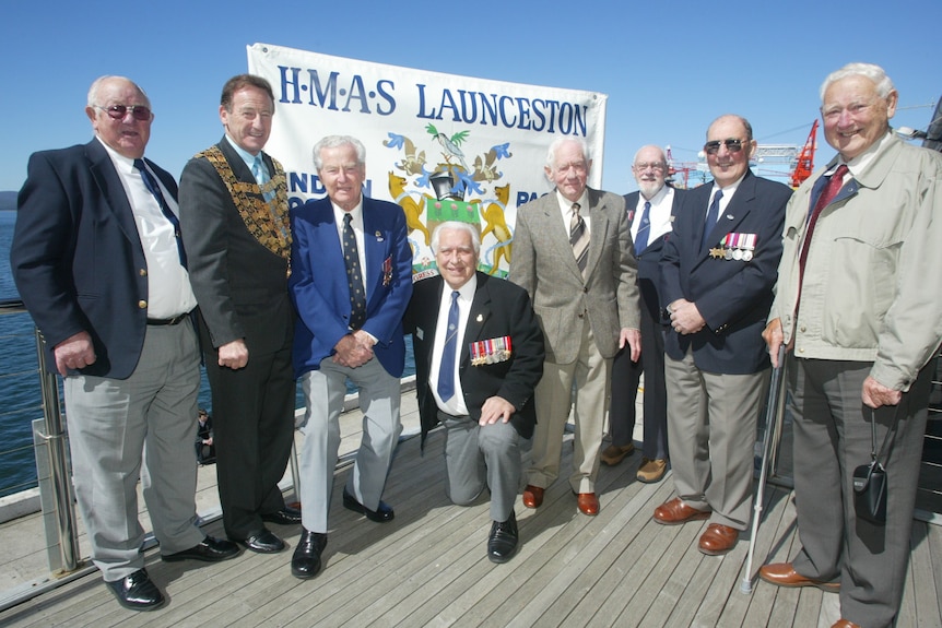 Former HMAS Launceston (I) crew members with Ivan Dean on board HMAS Launceston (III).