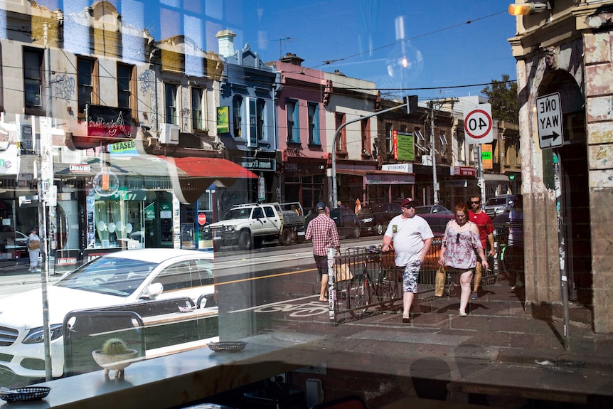 Looking out of a cafe window onto a busy street in Fitzroy.