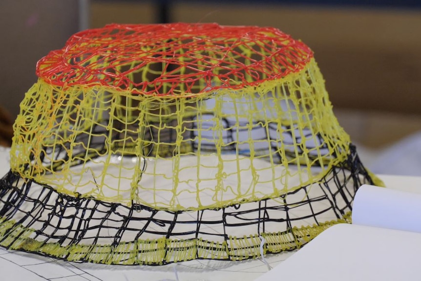 A multi-coloured hat design, made using a 3D printer pen.