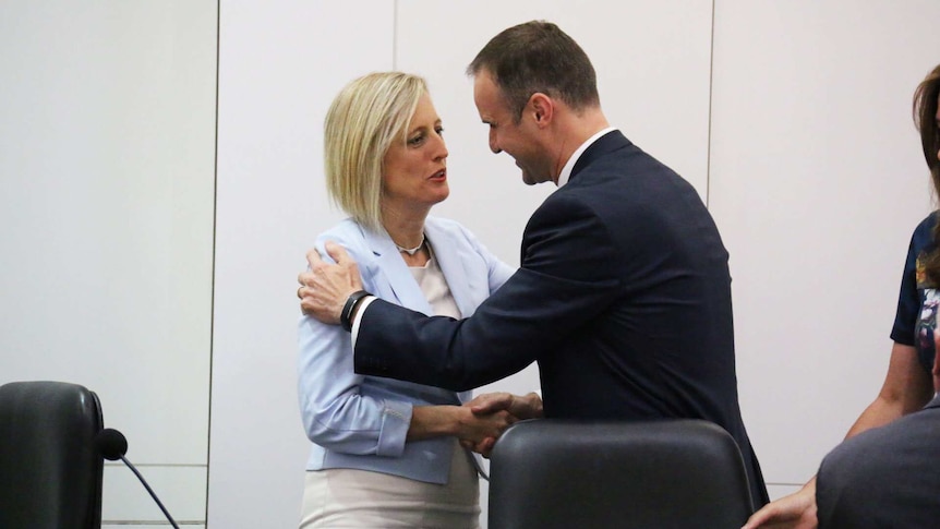 Former ACT chief minister Katy Gallagher congratulates newly-elected Chief Minister Andrew Barr.