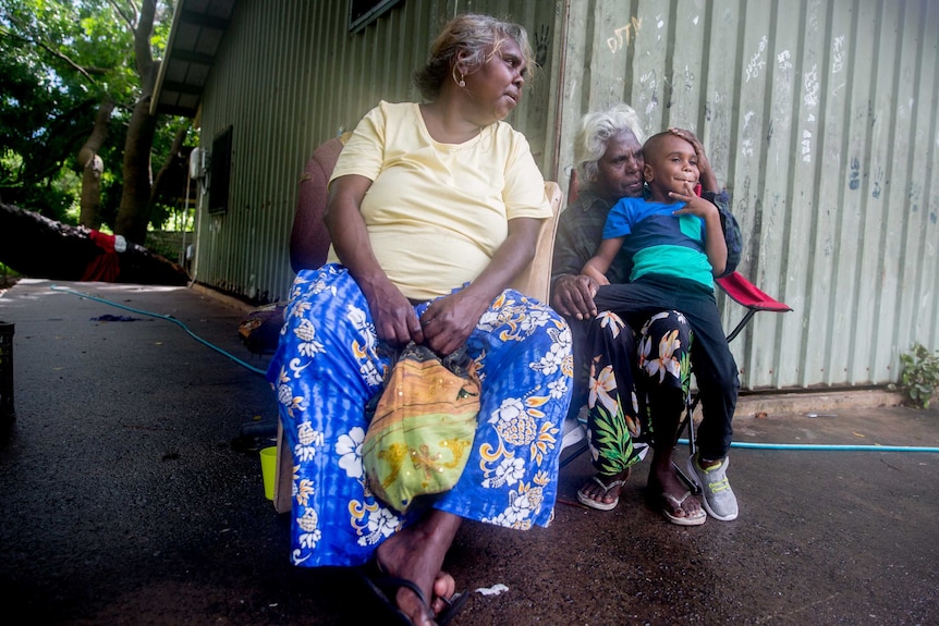 Rosemary and Mindy sit with Jay, a young family member in their care