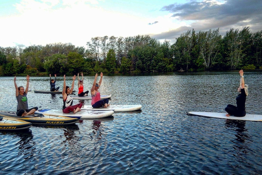 SUP yoga on Lake Burley Griffin.