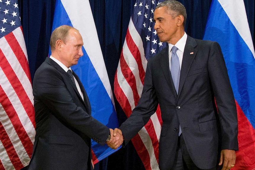 Russian President Vladimir Putin shakes hands with US President Barack Obama