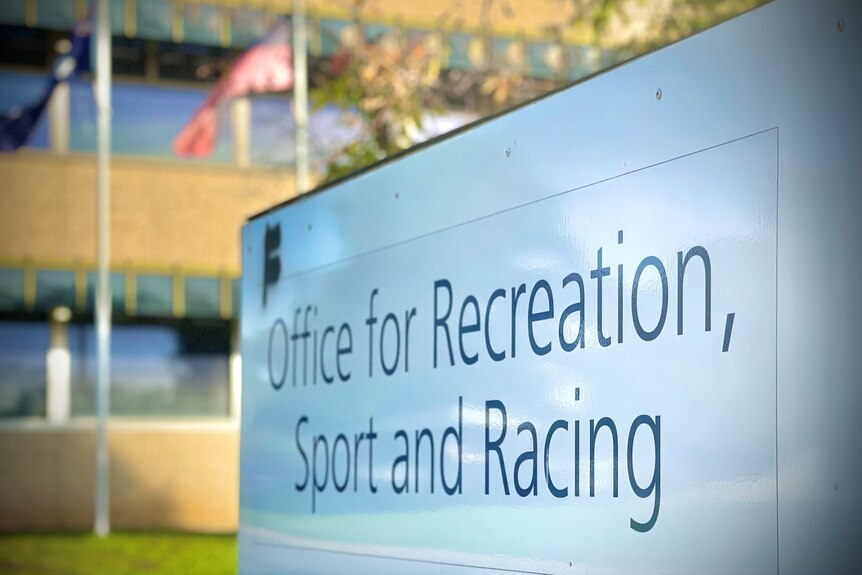 A close-up of a sign for the Office for Recreation, Sport and Racing