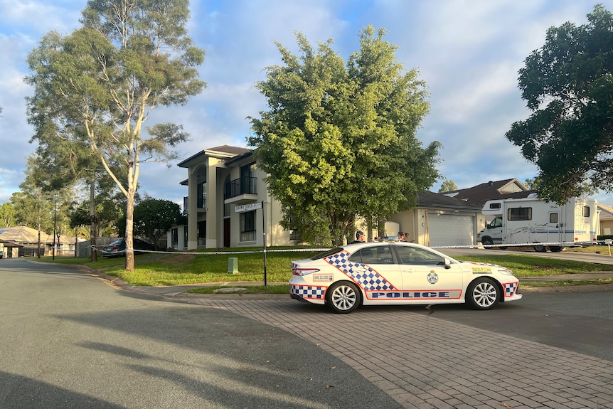 A police car outside a property in south-east Queensland.
