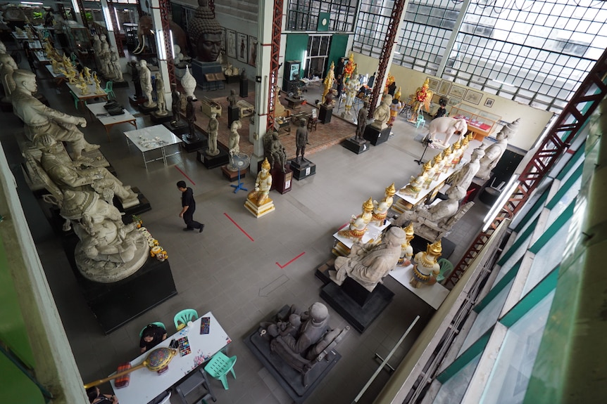 The crematorium in Bangkok is elaborately decorated with statues of Hindu gods, white elephants.