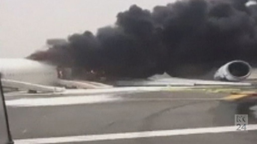 The Emirates plane burns on the runway