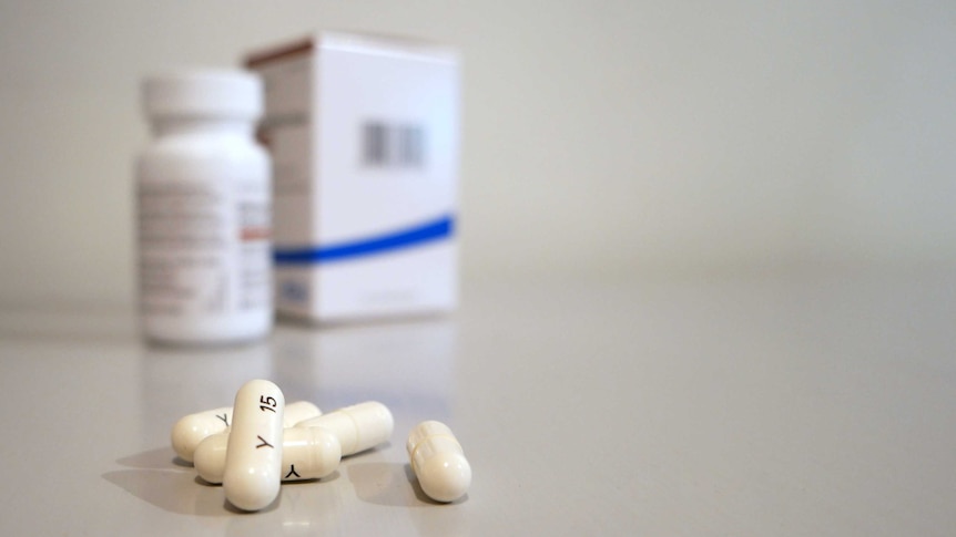 Generic capsule tablets with bottle and packaging.