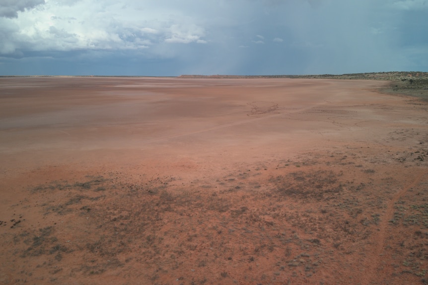 Drone vision of Salt lakes in a desert with clouds above