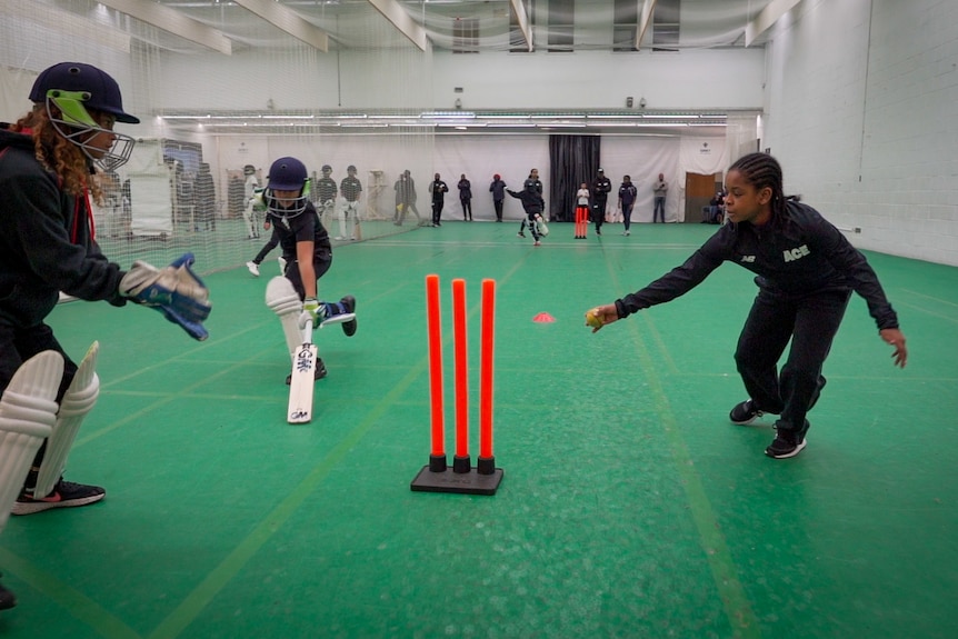 Young cricketers play at an indoor sporting venue in South London.