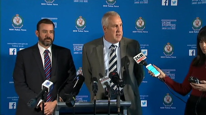 Police speak at a press conference after a 25-year-old is charged with terror-related offence