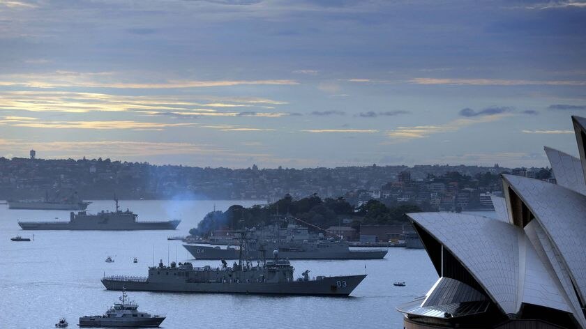 A fleet of 16 warships ships enters Sydney Harbour (AAP: Dean Lewins)