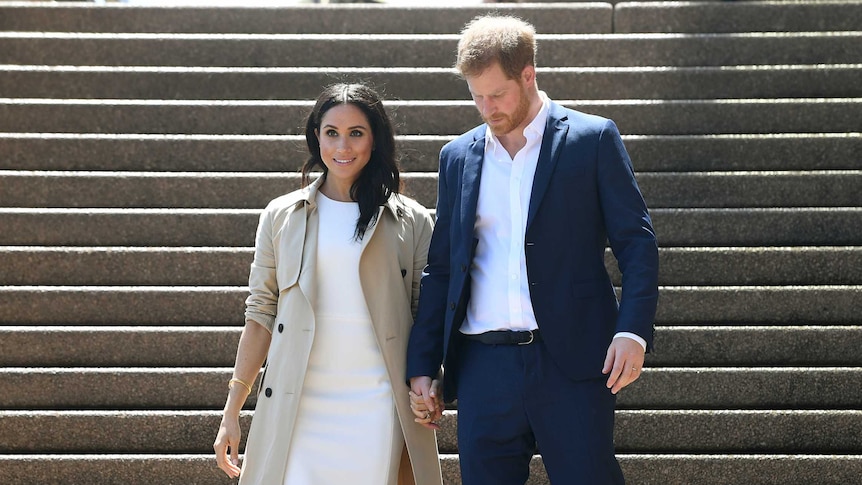 Prince Harry and Meghan on stairs