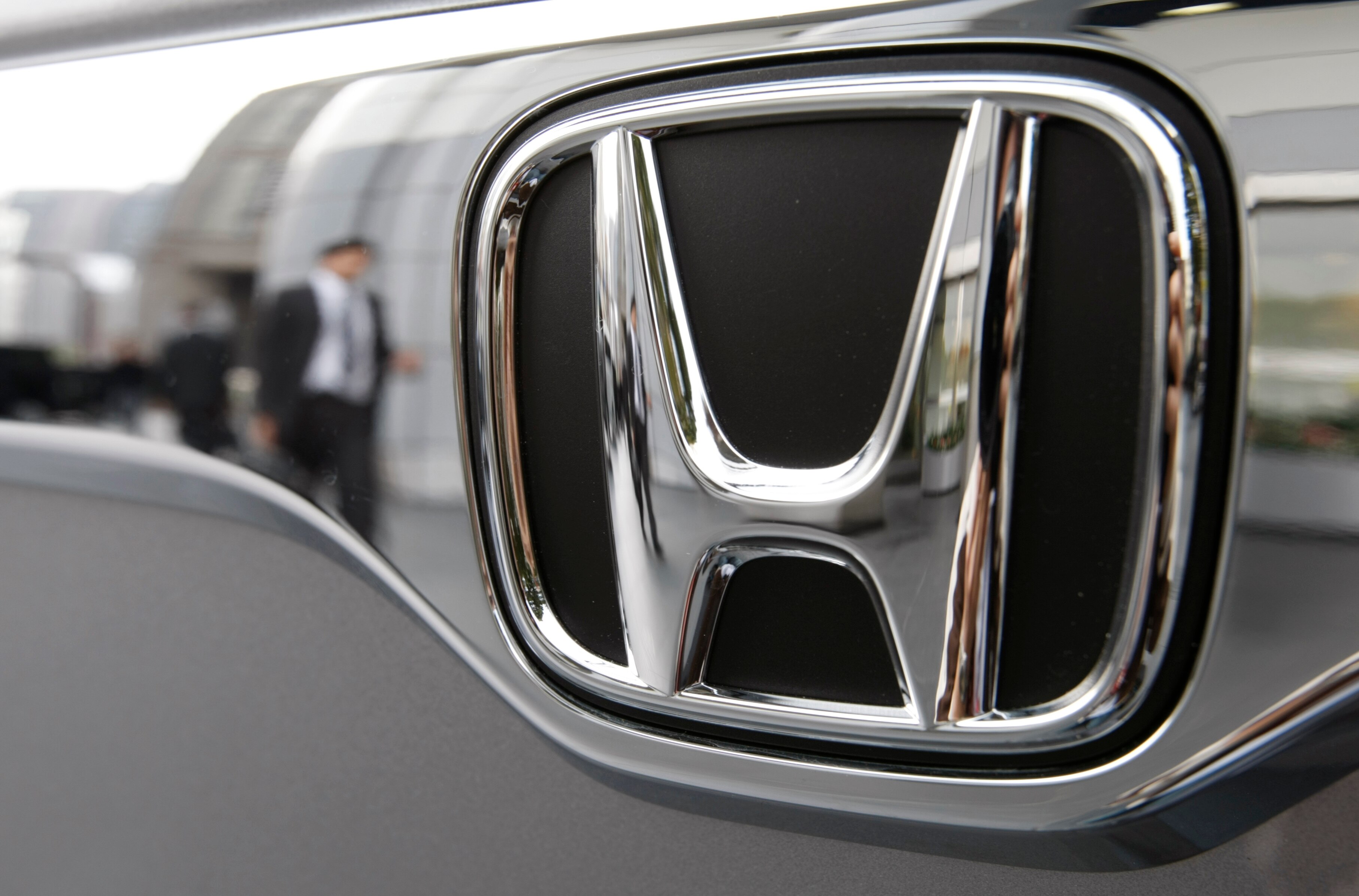 a shiny honda car badge