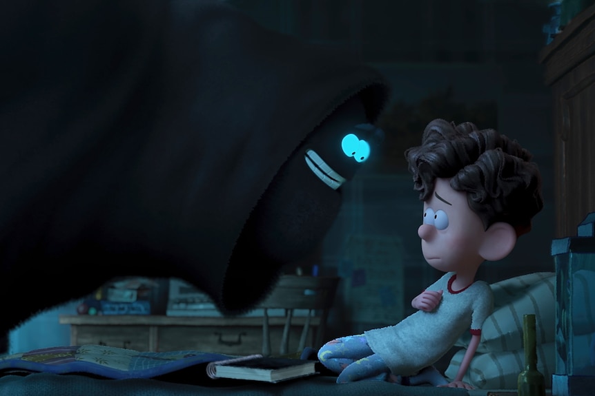 An animated boy next to a large black monster character