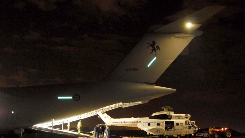 RAAF 36 Squadron load an SA330J Puma Helicopter onto their RAAF C-17A Globemaster