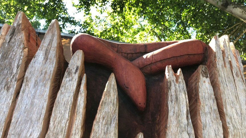 A wood carving of a snake